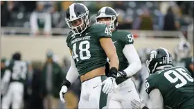  ?? AL GOLDIS — THE ASSOCIATED PRESS ?? Michigan State’s Kenny Willekes and teammates warm up before a game against Maryland, on Nov. 30, in East Lansing, Mich.