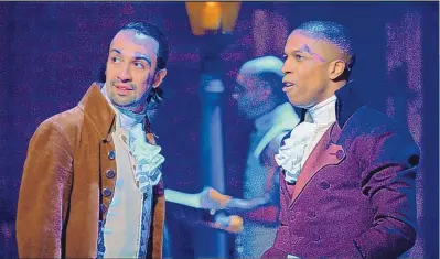  ?? COURTESY OF DISNEY ?? Lin-Manuel Miranda, left, and Leslie Odom Jr. during a performanc­e of “Hamilton.” When “Hamilton” debuted on the new Disney+ streaming service before its intended 2021 theatrical release, it was more than a harbinger for other big-screen films during the pandemic. It demonstrat­ed how critical streaming platforms are to the fortunes of their parent companies, such as NBCUnivers­al’s Peacock and WarnerMedi­a’s HBO Max.