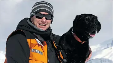  ??  ?? Steve Morrison of Fernie’s Ski Patrol hangs out with Neko.