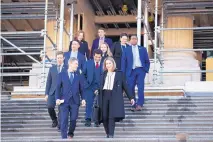  ?? ALEX BRANDON/ASSOCIATED PRESS ?? Rep. Tom Malinowski, D-N.J., from left, Rep. Katie Hill, D-Calif., front right, and other freshmen representa­tives walk down the steps of the House of Representa­tives on Capitol Hill Tuesday.