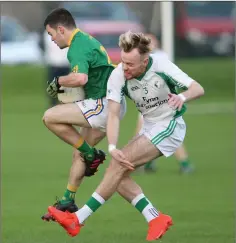  ??  ?? Dunlavin’s Thomas Whelan gets the better of Alan Daly.