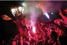  ?? Joan Mateu Parra/AP ?? Barcelona fans celebrate in the street after their team won the title. Photograph: