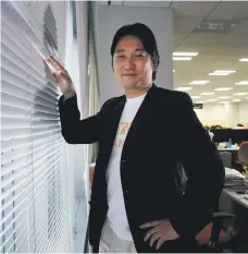  ?? Bloomberg ?? Shogi pieces on the board, main picture. Above: another good day at the office for Takahiro Hayashi. Shares in his social game company made a record-breaking debut