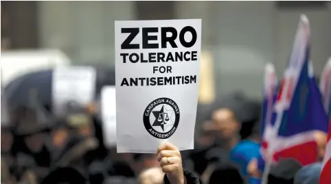  ?? (Reuters) ?? A SIGN against antisemiti­sm.