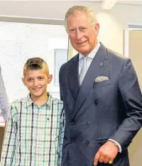  ??  ?? ■ The Prince of Wales met a refugee family who escaped Syria and are now living in Cardiff