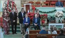  ?? CONTRIBUTE­D ?? Former President Jimmy Carter and former first lady Rosalynn Carter join the other deacons at the front of the church Sunday after the newest class of deacons is ordained during the morning service at Maranatha Baptist Church in Plains.