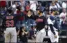  ?? ELAINE THOMPSON — AP ?? Yan Gomes is greeted at home by Greg Allen after his three-run home run in the ninth inning.