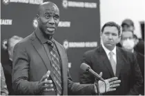  ?? WILFREDO LEE AP ?? Florida Surgeon General Dr. Joseph A. Ladapo, left, speaks at a news conference with Florida’s Gov. DeSantis in January at Broward Health Medical Center.