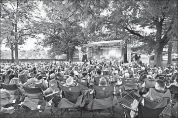  ?? NAPER SETTLEMENT ?? A crowd attends a concert at Naper Settlement in DuPage County, one of four suburban counties that saw population growth from 2010-19, according to a study from a Chicago planning agency.