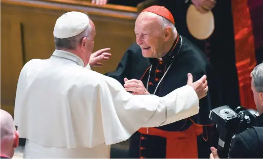  ?? WASHINGTON POST POOL PHOTO VIA AP ?? Pope Francis and then-Cardinal Theodore McCarrick greet each other in 2015 in Washington.