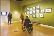  ?? (NWA Democrat-Gazette/Flip Putthoff) ?? Visitors view “Ansel Adams, In Our Time” in November at Crystal Bridges Museum of American Art in Bentonvill­e. The exhibit runs through Jan. 3.