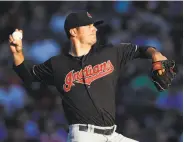  ?? Jim Young / Associated Press ?? Cleveland starter Adam Plutko was more nervous about stepping to the plate than onto the mound.