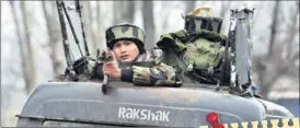  ?? Waseem Andrabi/HT ?? A soldier near the site of encounter in Pulwama on Monday.
