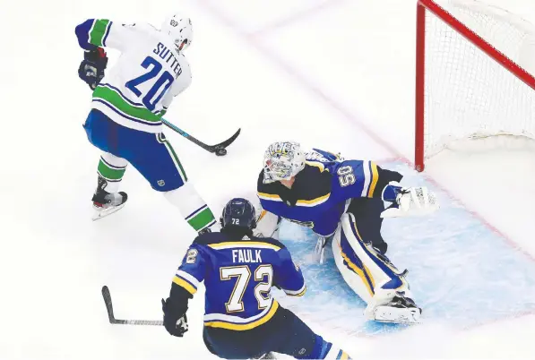  ?? JEFF VINNICK/GETTY IMAGES ?? Canucks forward Brandon Sutter is foiled by Blues goalie Jordan Binnington in the opening game of their first-round Western Conference playoff series on Wednesday night at Rogers Place in Edmonton. The Canucks got off to a great start with a 5-2 victory.