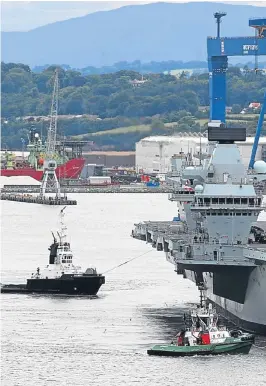  ?? Pictures: Getty. ?? The new Royal Navy aircraft carrier HMS Queen Elizabeth departs Rosyth dockyard to be tested in the North Sea. She is expected to formally enter service in 2020.