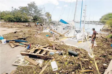  ?? MIKE STOCKER/STAFF PHOTOGRAPH­ER ?? A sailboat crashed and smashed at the Dinner Key Marina in Miami during Hurricane Irma.