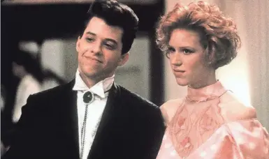  ??  ?? Duckie (Jon Cryer) and Andie (Molly Ringwald) were not fated to end up together in “Pretty in Pink.” The movie is re-released on Blu-ray in the “John Hughes 5-Movie Collection.”