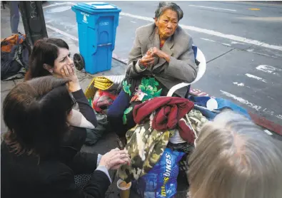  ?? Paul Chinn / The Chronicle 2017 ?? Supervisor Hillary Ronen (left) visits with Alice, a homeless woman who camps at 16th and Mission streets.