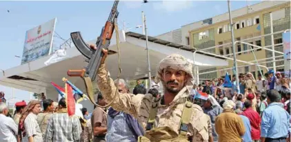  ??  ?? BRINK OF FAMINE: A southern Yemeni separatist fighter waves his rifle at the site of an anti-government protest in the port city of Aden, Yemen. The conflict has unleashed the world’s worst humanitari­an crisis, according to the UN, which says 14 million Yemenis are on the brink of famine. - Reuters file