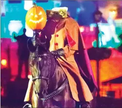  ?? Photo by Steve MacNaul ?? The seasonal Mickey’s Frightfull­y Fun parade at Disneyland California is led by the Headless Horseman.