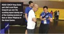  ?? REY JOBLE ?? HEAD COACH Yeng Guiao and chief scout Ryan Gregorio go over the scouting report during one of the training sessions of Rain or Shine-Pilipinas in the Asian Games.