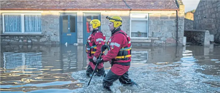  ?? ?? Clockwise from main picture: Search and rescue crews patrol a flooded street in the Port Elphinston­e area of Inverurie in 2016 after the River Don burst its banks; Philip McKay, Aberdeensh­ire Council’s head of roads; and one of the red and green bridges that have been installed from the Low Wood Road over the River Carron as part of flood protection work in Stonehaven.