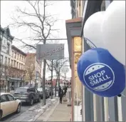  ?? Diego Mendoza-moyers / Times Union ?? Balloons and decoration­s welcomed shoppers to downtown Troy on Small Business Saturday. Throughout the country, shoppers spent nearly $18 billion at local, independen­tlyowned businesses.