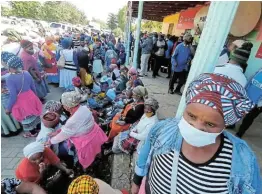  ?? Picture: LULAMILE FENI ?? FRIGHTENED: People from Zingqolwen­i gather outside the Cacadu magistrate’s court on Friday for the appearance of a number of suspects accused of killing seven youths in April. The villagers are living fear after three more elderly women were found dead on Friday.