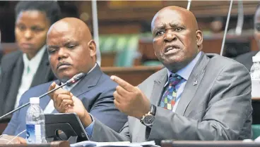  ?? /Trevor Samson ?? Unfit for office: Former Hawks head Berning Ntlemeza, right, may soon be pursued by police chief Khomotso Phahlane, left.