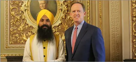  ?? SUBMITTED PHOTO ?? U.S. Sen. Patrick Toomey, R-Pa., poses for a photo with Sukhvinder Singh, the Giani (pastor) of the Philadelph­ia Sikh Society’s Gurudwara (church) in Millbourne.