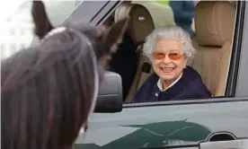  ?? Photograph: Chris Jackson/Getty Images ?? The Queen smiles from the passenger seat of her vehicle at the horse show on Friday.