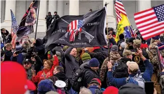  ??  ?? DIFFERENT TAKES A Punisher-inspired flag on January 6. Actor Jon Bernthal (below), denounced the rioters, saying they misunderst­ood the character.