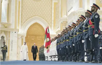  ??  ?? Sheikh Mohamed and Mr Putin inspect the Guard of Honour at Qasr Al Watan in Abu Dhabi Ministry of Presidenti­al Affairs