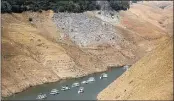  ?? NOAH BERGER — THE ASSOCIATED PRESS FILE ?? Houseboats rest in a channel at Lake Oroville State Recreation Area in Butte County.