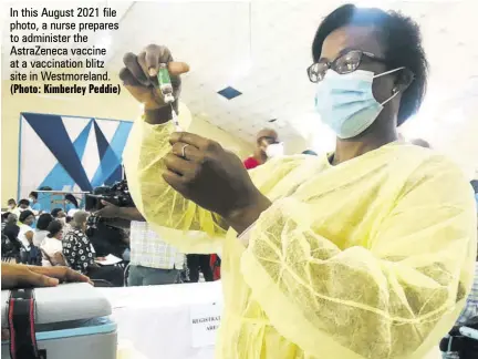  ?? (Photo: Kimberley Peddie) ?? In this August 2021 file photo, a nurse prepares to administer the Astrazenec­a vaccine at a vaccinatio­n blitz site in Westmorela­nd.