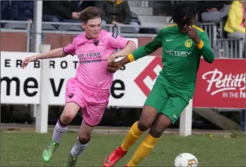  ??  ?? Evan Connolly of Wexford F.C. giving chase to Daryl Natumba(Carlow/Kilkenny).