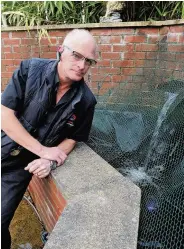  ??  ?? Anger Allan Barwick looks into his outdoor pond, which has been targeted by thieves