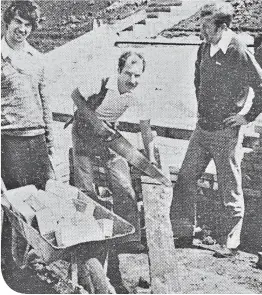  ??  ?? Alex Beckett gets to work, watched by team-mate Phil Mcaveety (left) and manager Jim Clunie