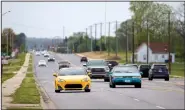  ?? NWA Democrat-Gazette/JASON IVESTER ?? Traffic moves Thursday along Southwest Regional Airport Boulevard in Bentonvill­e.