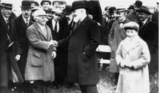  ??  ?? Harry Beasley (left) is congratula­ted by Governor General Tim Healy after winning at Punchestow­n in 1921 when he was 71. He rode his first winner in 1876, aged 24