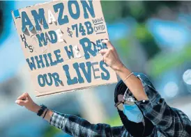  ?? /AFP ?? Safety concerns: Workers at an Amazon delivery hub in Hawthorne, California, protest against the alleged failure of their employers to provide adequate workplace protection in the face of the coronaviru­s pandemic.