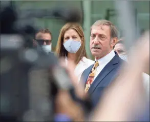  ?? Hearst Connecticu­t Media file photo ?? Attorney Jon Schoenhorn speaks to the media after representi­ng Michelle Troconis, left, at state Superior Court in Stamford on Aug. 28.