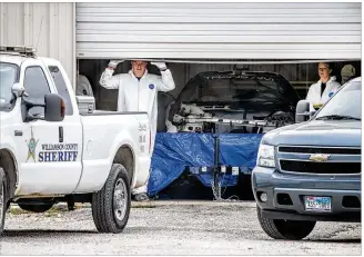  ?? RICARDO B. BRAZZIELL / AMERICAN-STATESMAN ?? A white Pontiac Trans Am is parked Friday at a Williamson County facility. Sheriff Robert Chody said the car was recovered in the Dallas area after officials got a tip.