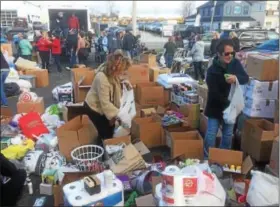  ?? PETE BANNAN – DIGITAL FIRST MEDIA ?? Hundreds of volunteers collected items for victims of the fire at Barclay Friends senior home on Sunday at Good Will Fire Company.