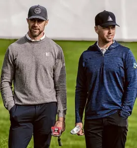  ?? ?? Posey, right, talks with former 49ers QB Alex Smith on the third green during Friday’s second round at Pebble Beach.