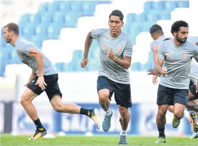  ?? Picture: AP. ?? Roberto Firmino led the sprints during yesterday’s training session as Liverpool prepared at the Rhein Neckar Arena in Sinsheim, Germany.