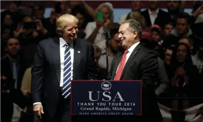  ?? Photograph: Mike Segar/Reuters ?? Donald Trump greets Andrew N Liveris, chairman and CEO of Dow Chemical, at a rally in Grand Rapids, Michigan, in December 2016.