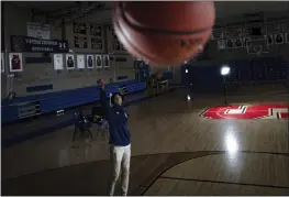  ?? ROBERT BUMSTED — THE ASSOCIATED PRESS ?? Johnuel “Boogie” Fland shoots hoops in the gymnasium of Archbishop Stepinac High School in White Plains, N.Y., Monday. Fland is among a growing number of high school athletes who have signed sponsorshi­p deals.