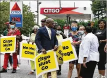  ?? NATRICE MILLER/NATRICE.MILLER@AJC.COM ?? Adamsville community members rally against crime at the Citgo
gas station on Martin Luther King Jr. Drive in Atlanta on Wednesday. Atlanta police Maj. Reginald Moorman said there have been 394 calls
for police service there.