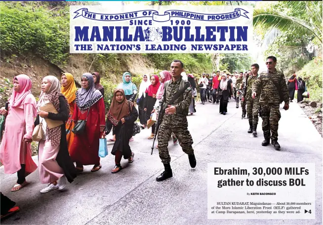  ?? (Keith Bacongco) ?? CONSULTATI­VE ASSEMBLY – MILF fighters are deployed as a security force as thousands of MILF attend a consultati­ve assembly in Sultan Kudarat town, Maguindana­o, Sunday. The assembly discussed the Bangsamoro Organic Law which President Duterte signed last week.